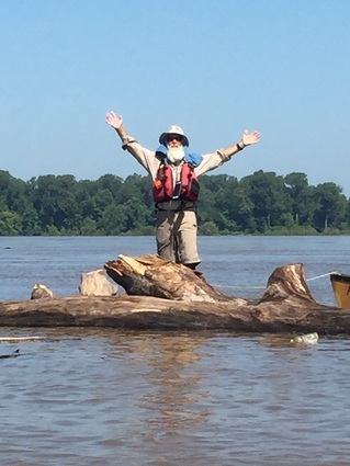 Dale Sanders on a floating log